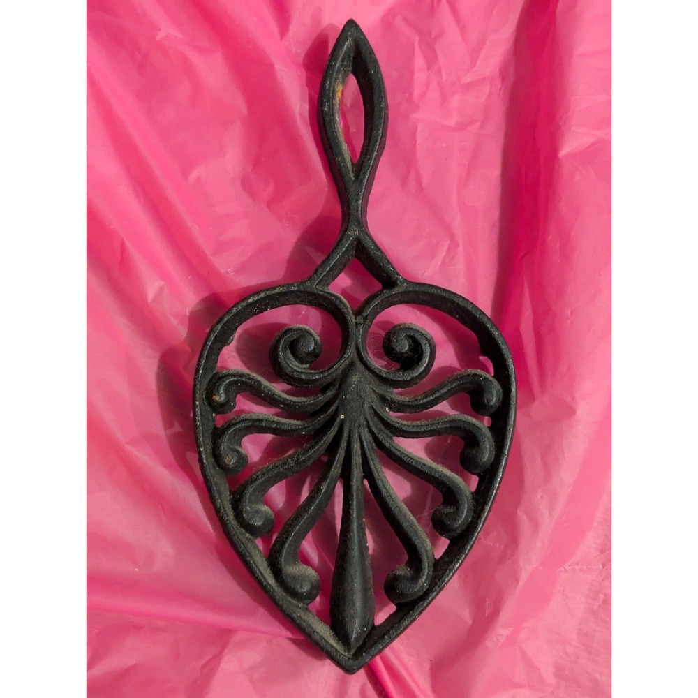 vintage cast iron? scrolled trivet with handle